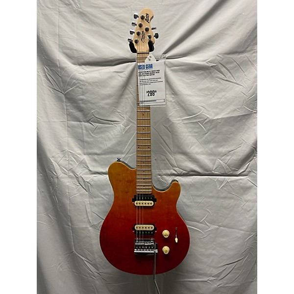 Used Sterling by Music Man SUB AX4 Solid Body Electric Guitar Trans Orange  | Guitar Center