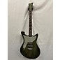 Used Used Wild Customs Savage One Metallic Finish Green Solid Body Electric Guitar thumbnail