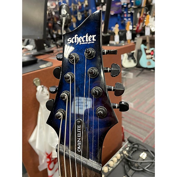 Used Used 2022 Schecter Guitar Research Omen Extreme 8 See Through Blue Burst Solid Body Electric Guitar