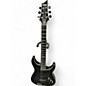 Used Schecter Guitar Research Hellraiser C1 Hybrid Trans Black Solid Body Electric Guitar thumbnail