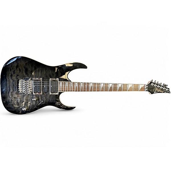 Used 2010 Ibanez RG4EXQM1 Trans Black Solid Body Electric Guitar