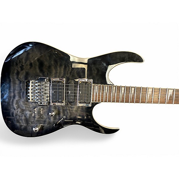 Used 2010 Ibanez RG4EXQM1 Trans Black Solid Body Electric Guitar