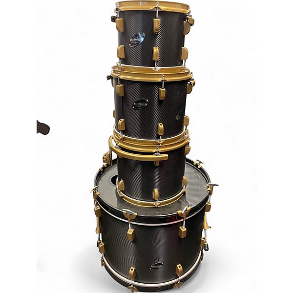 Used 2020s Ludwig 7 Piece 7 piece rocker drum set black carbon fiber wrap finish with gold hardware Drum Kit