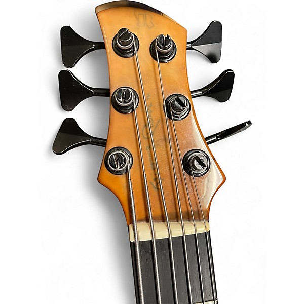 Used Roscoe SKB3006 Milky Honey Burst Electric Bass Guitar