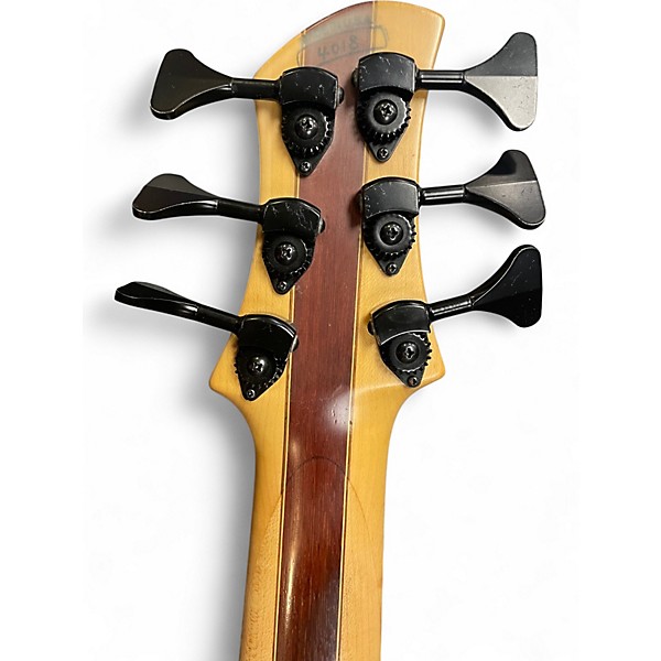 Used Roscoe SKB3006 Milky Honey Burst Electric Bass Guitar