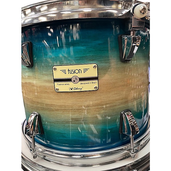 Used Odery 4 Piece Fluence Fusion Blue Burst over Ash Drum Kit