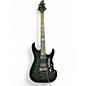 Used Schecter Guitar Research Damien Elite 6 Floyd Rose See-Thru Black Solid Body Electric Guitar thumbnail