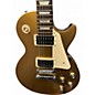 Used 2012 Gibson Les Paul Tribute Antique Gold Solid Body Electric Guitar thumbnail