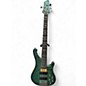 Used Caraya RHYTHMIC SYMPHONY TRANS TURQUOISE Electric Bass Guitar thumbnail