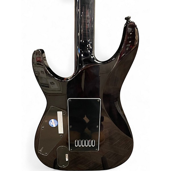 Used ESP LTD MH1000 Deluxe Trans Black Solid Body Electric Guitar