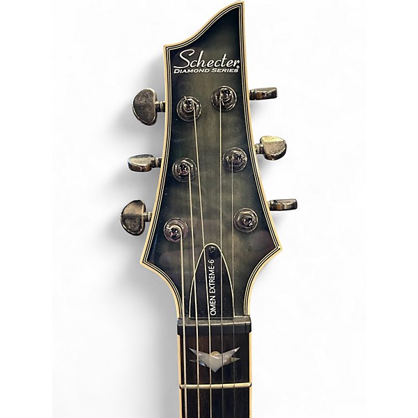 Used 2012 Schecter Guitar Research Omen Extreme 6 TRANS QUILTED BLACK Solid Body Electric Guitar
