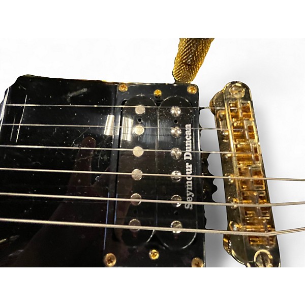 Used Jackson RR5 Randy Rhoads Black and Gold Solid Body Electric Guitar