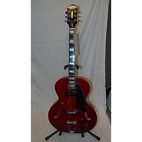 red hollow body electric guitar